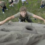 Drew Reinert, 12, of Franklin WI scales the rock climbing wall at the 2010 Wisconsin National Guard Youth Camp. Campers in the 11-13 year old age group also took part in a leadership course, swimming, and tug of war competition. Photo by Department of Military Affairs photographer Sgt. Andy Poquette.